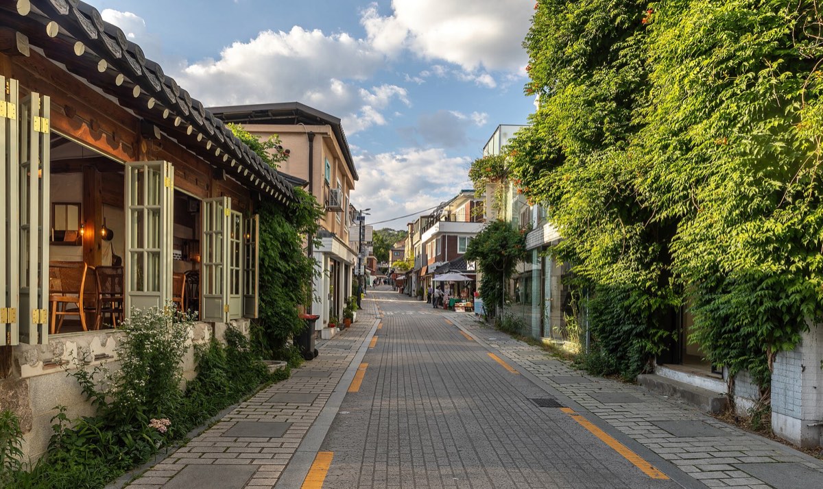 The hanok-lined lanes of Bukchon Hanok Village in Seoul at golden hour